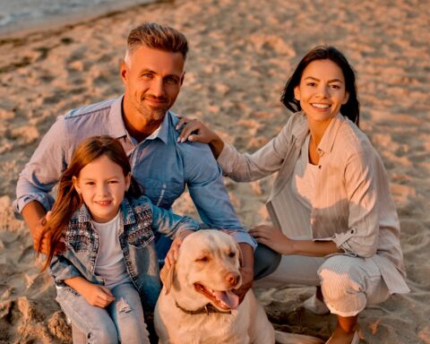 Family on the beach with their dog