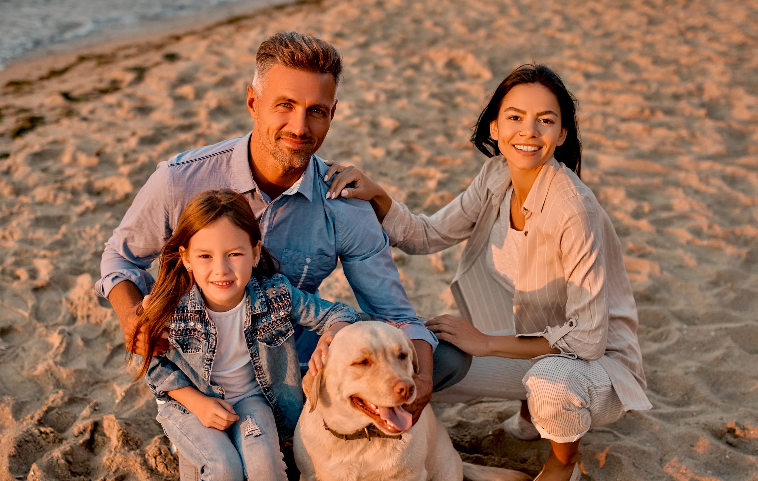 Family on the beach with their dog