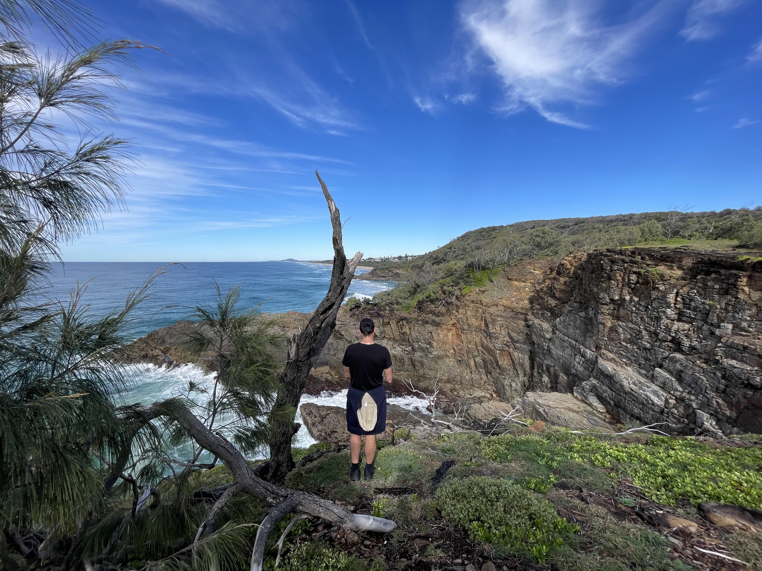 man standing at the top of the cliff devils kitchen 
