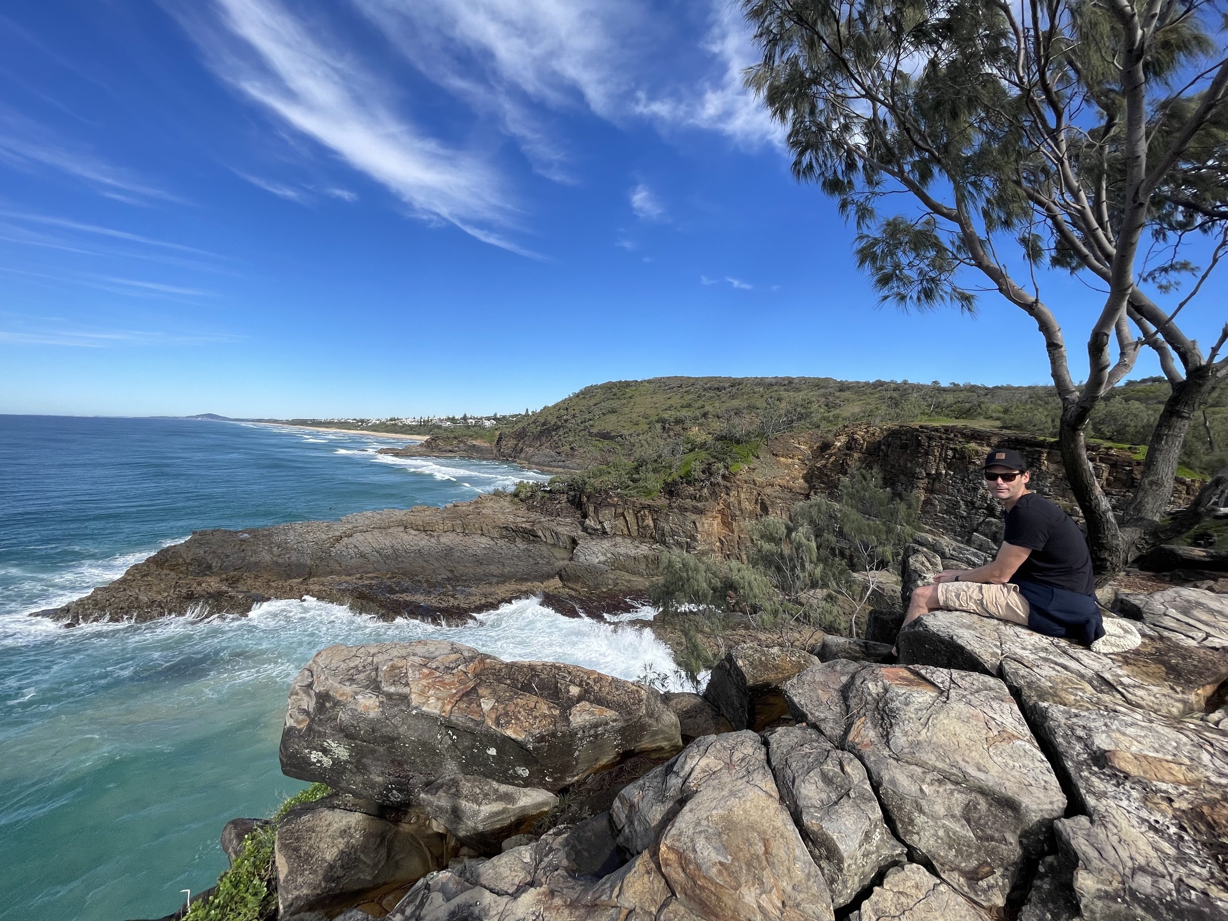 Visitor sat on the cliff at Devils Kitchen