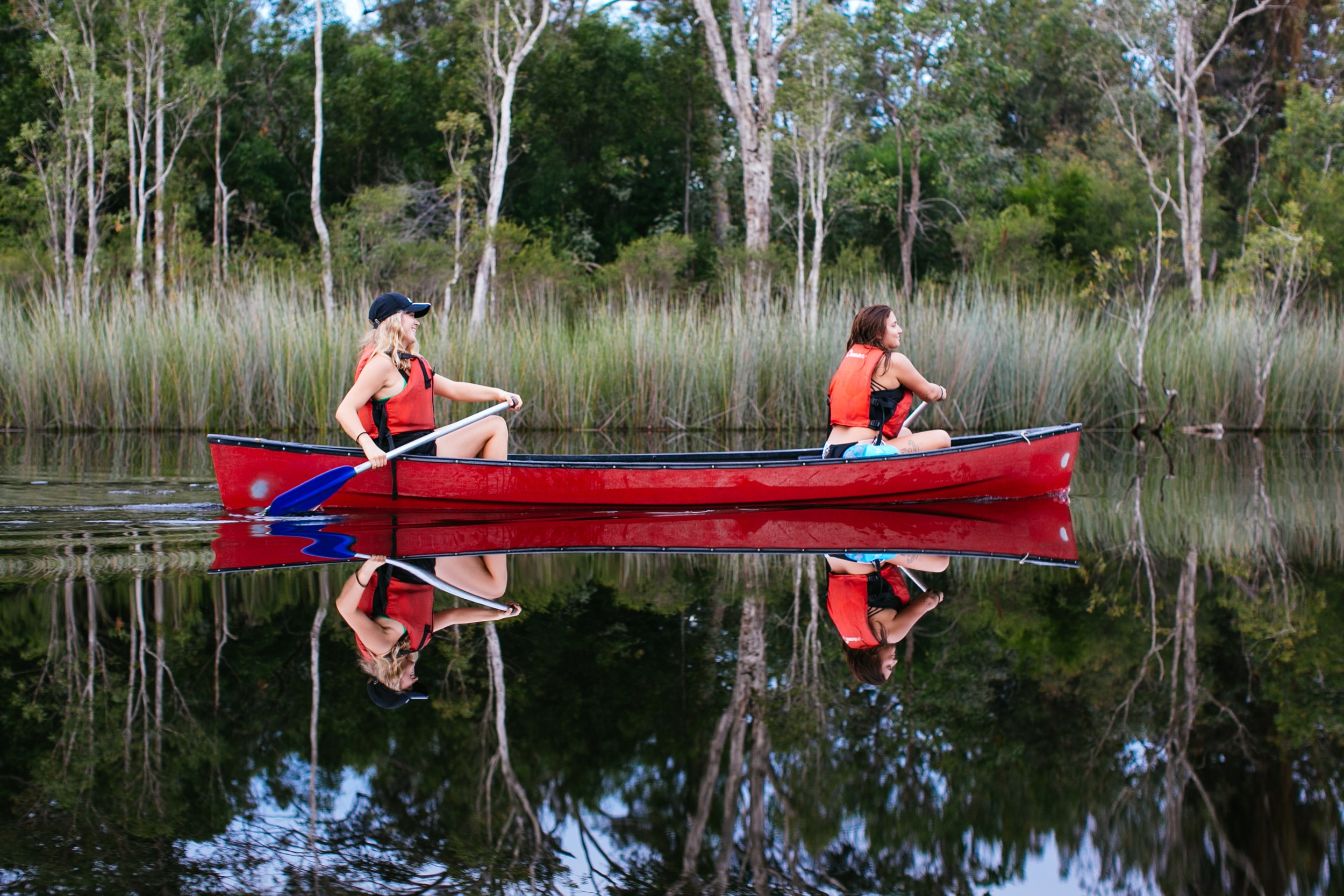 Reflections on the River of Mirrors  - 2 ladies canoeing in the Everglades